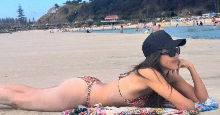 Jessica Alba Spotted Sunbathing on Beach in Chic Bikini