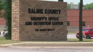 Nude man arrested after roommate found shot dead in Saline County