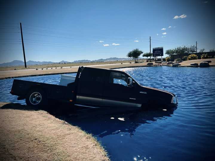 Pickup truck plunges into pond in Amarillo Creek