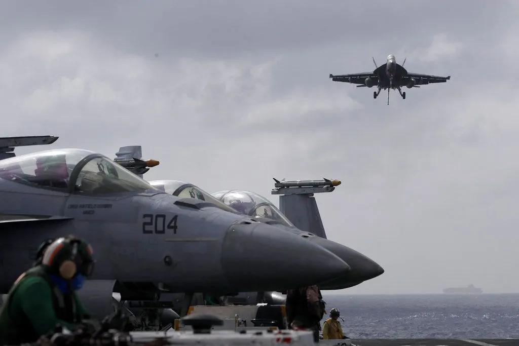 US Navy fighter jet and helicopter crash in South China Sea