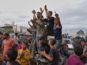 Photos: Gaza residents flood streets in hope that Israel’s war is ending