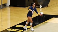Alexandra Durkin gets the big kill that sends the Wildcats to victory