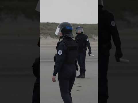 Dramatic Moment Police Face off with 100 Migrants Running Towards Boat in France #shorts
