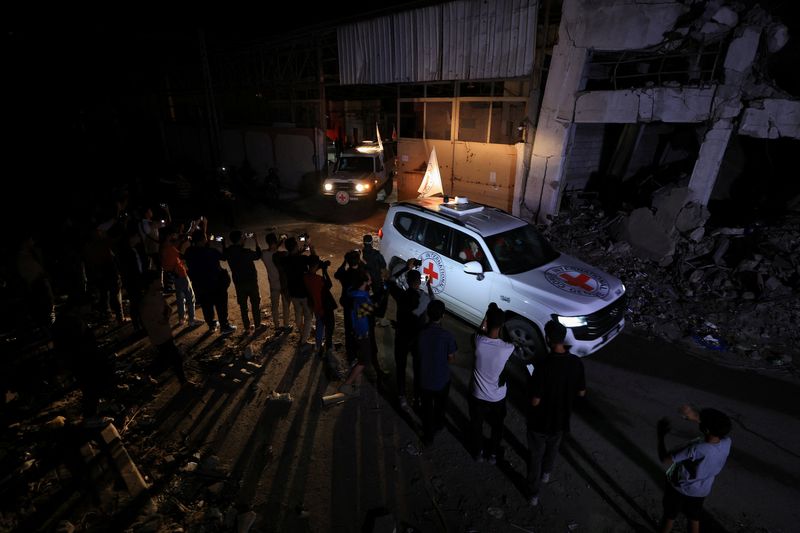 Hamas hands over hostage bodies after Israel threatens aid cut