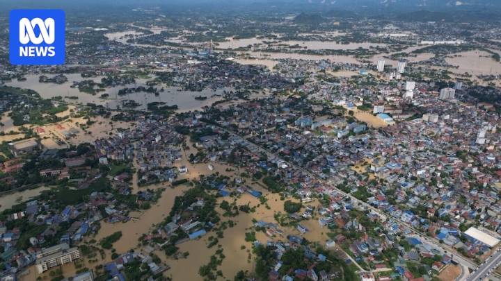Record flooding in Vietnam kills at least eight people with the army deployed to help with recovery effort