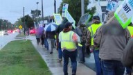 Plumbers picket outside Moore Mechanical in Grand Rapids in effort to unionize