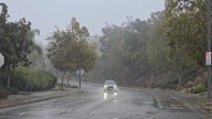 Firefighters Mount Rescue for Man Swept Down Storm Canal Amid Rainstorm in Riverside