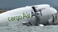 Cargo plane fatally slides off runway in Hong Kong