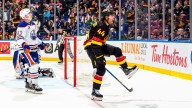 Sherwood scores 2, Canucks recover in OT against Oilers to end 3