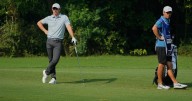 Shane Lowry leads in India with a 64, Rory McIlroy leaves driver out of the bag and shoots 69