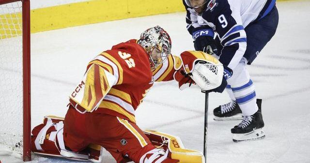 Scheifele scores late as Jets burn Flames 2