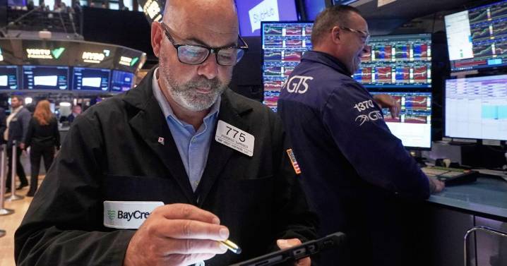 Wall Street claws back some big losses as Trump softens tone on China