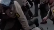 Protesters clash with police outside ICE facility