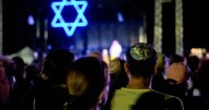 Vigils mark Israel attack anniversary, Gaza death toll