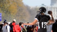 Audience Boos As Football Game Breaks Out At Political Rally