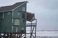 Dozens rescued as remnants of typhoon hits Alaska while nor'easter brings flooding to East Coast
