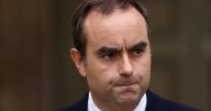 Macron asks outgoing French PM to hold last