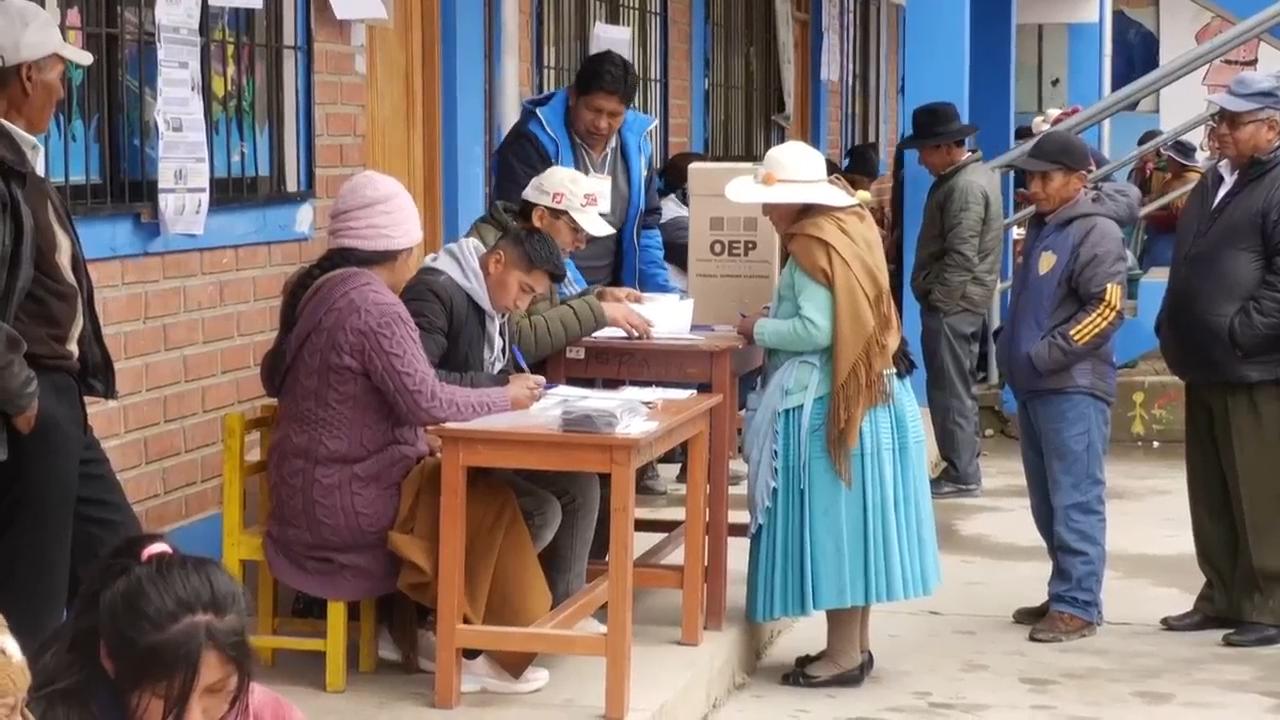 Presidential candidates votes as Bolivia holds a tight runoff