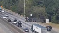 Overturned tractor-trailer blocking several lanes of I
