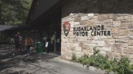 Visitors react to the first day of the government shutdown at GSMNP