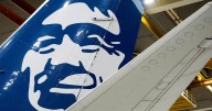 Alaska Airlines says an information technology outage is grounding its flights