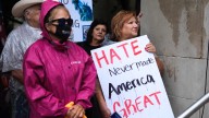 Signs and messages of defiance seen at 'No Kings' Trump protests