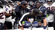 NFL official Nate Jones goes viral protecting Seahawks' Jaxon Smith