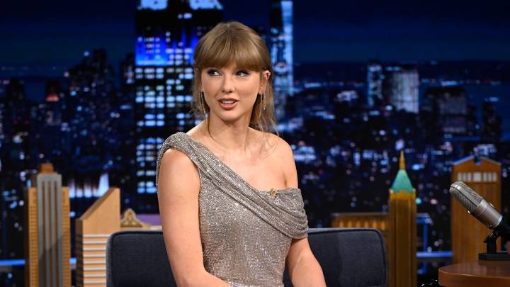 Taylor Swift showcases her ultra long legs in silver mini dress in head-turning appearance on The Tonight Show