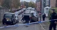 Fatal stabbing after car chase as vehicle seen on its roof