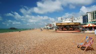 Three men charged with raping woman at Brighton beach