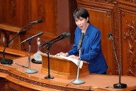 Japan's new leader vows to further bolster defense buildup and spending as regional tensions rise