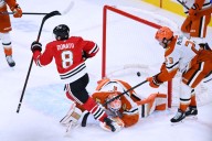 Ducks fall to Blackhawks in overtime, Joel Quenneville returns to Chicago