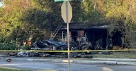 Woman, her dog found dead after RV fire outside Dallas home, authorities say