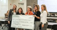 Business Incubator presents $1,210 check to D51 Foundation