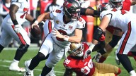 Mayfield tosses two TDs, Buccaneers cruise past injury