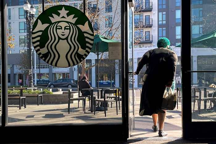 Starbucks sales improve but store closures and layoffs take a bite out of profits
