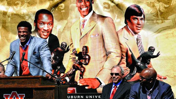 Which Auburn football players have retired jersey numbers?