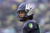 Oregon quarterback Dante Moore leaves with apparent nose injury against Wisconsin