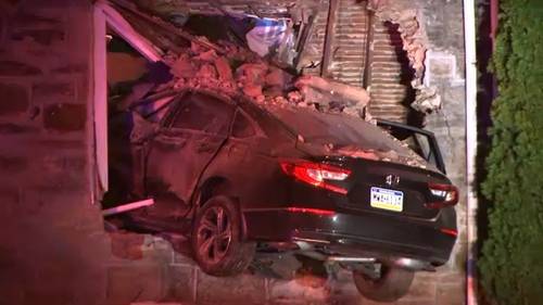 Driver runs off after car goes airborne, crashes through window home in the Frankford section of Philadelphia