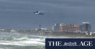 Victoria weather: Two men swept off Frankston pier as wild weather batters state