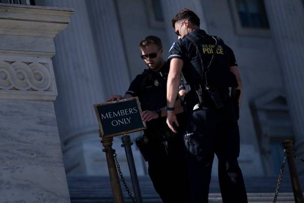 As they go unpaid, Capitol Police are a daily reminder for lawmakers of shutdown pain