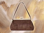 Get the Coach look: A New Day Kiss Lock Clutch Bag for $30