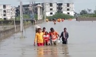 Cyclone Impact: Heavy rains cause flash floods in Telangana, people wade through knee