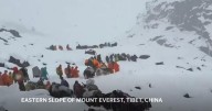 Villagers ascend Mount Everest with horses and oxen to join snowstorm evacuation effort