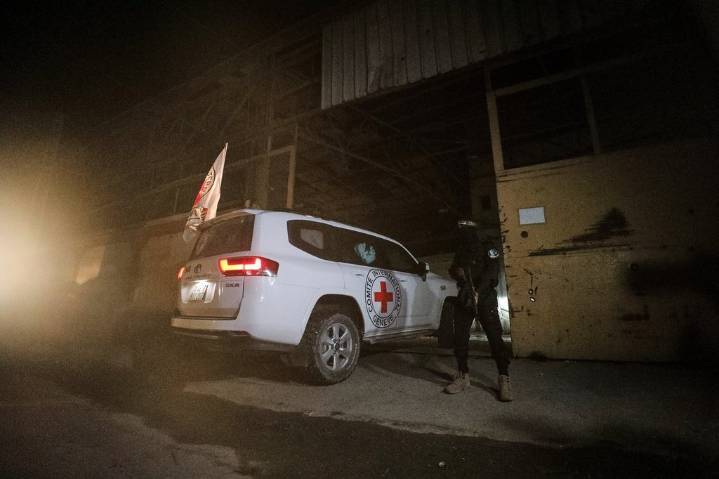 The Latest: Israel says one body handed over wasn’t a hostage as aid trucks head for Gaza