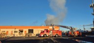 Fire crews fight fire in building south of downtown Las Vegas