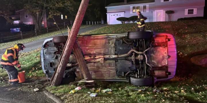 Driver rescued from overturned car after striking pole in North Haven