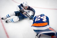 Toews gets 1st point in 2 1/2 years, Jets have 5 players score in win over Islanders