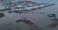 Officials airlift evacuees to safety after the remnants of Typhoon Halong devastate Alaska villages